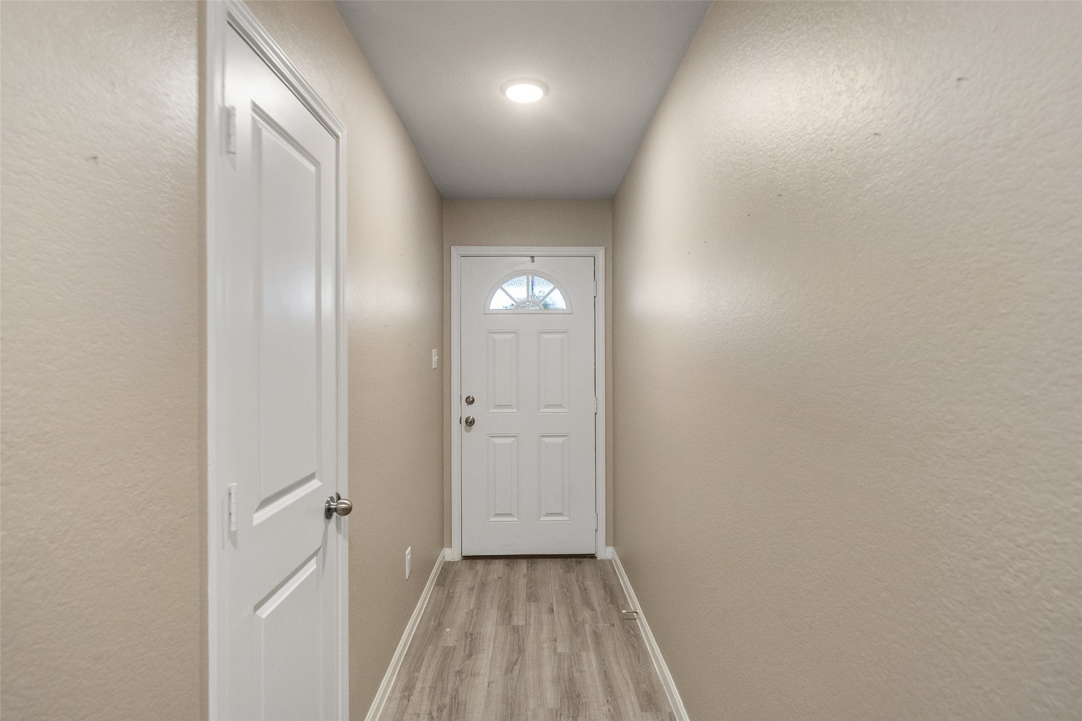 26431 Pin Oak Drive Hempstead, TX 77445 - Photo 7 of 31 a view of a hallway with wooden floor