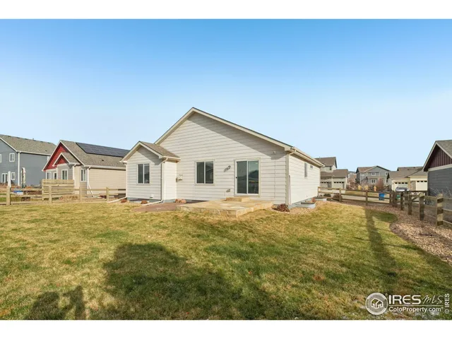 a view of a house with a yard covered in snow