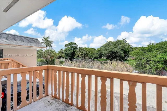 a view of a balcony with a swing