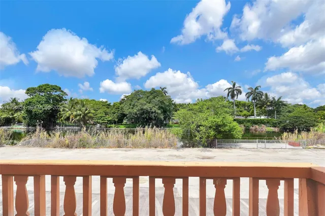 a view of balcony with wooden floor