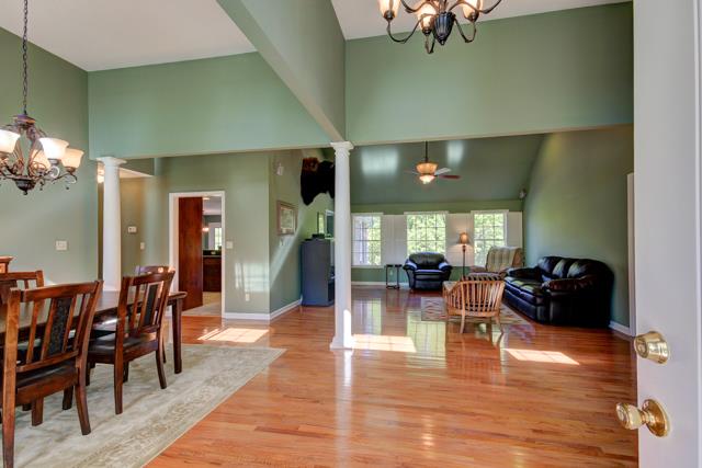 Entry features open concept with 12 ft ceilings, hardwood flooring, crown molding the list goes on
