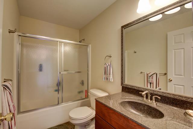 3456 Lake Road Woodlawn, TN 37191 - Photo 11 of 20 2nd bath features tub shower combo , custom vanity with solid surface, upgraded mirror and tile flooring as well as linen closet