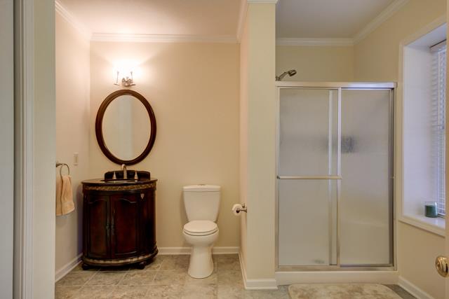 3456 Lake Road Woodlawn, TN 37191 - Photo 14 of 20 Full bath on lower level features custom vanity,double shower,tile flooring, and large storage closet