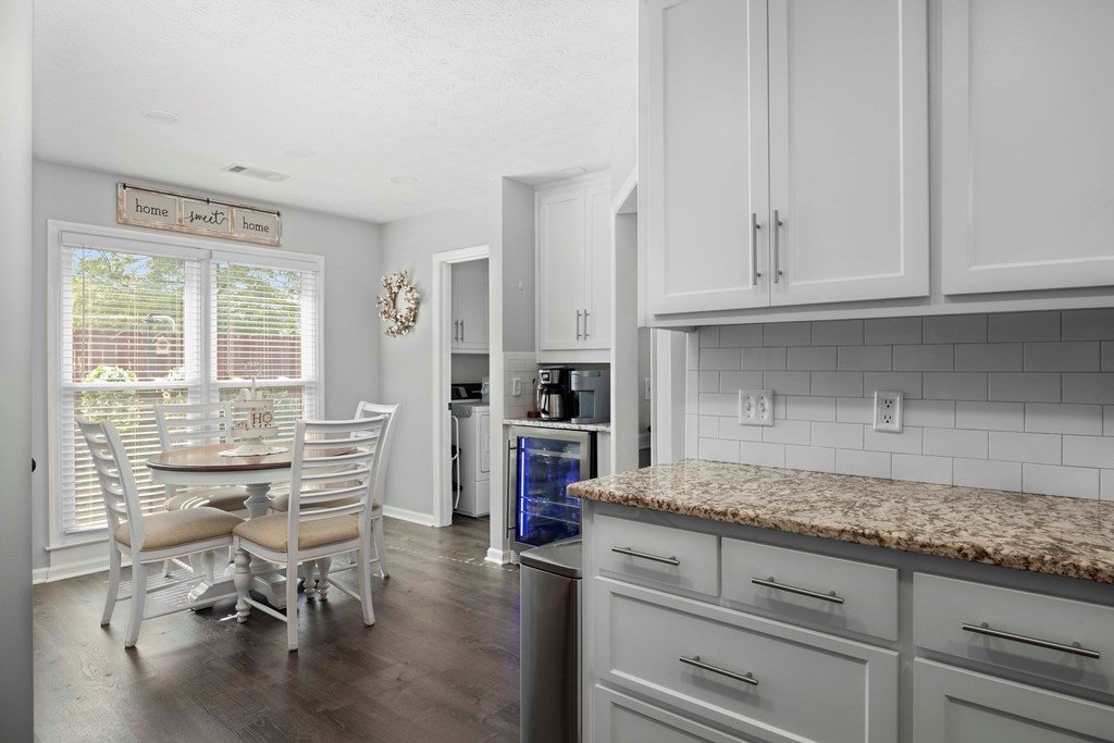 5017 Emerald Isle Court Columbus, GA 31909 - Photo 15 of 37 a kitchen with granite countertop white cabinets and white appliances