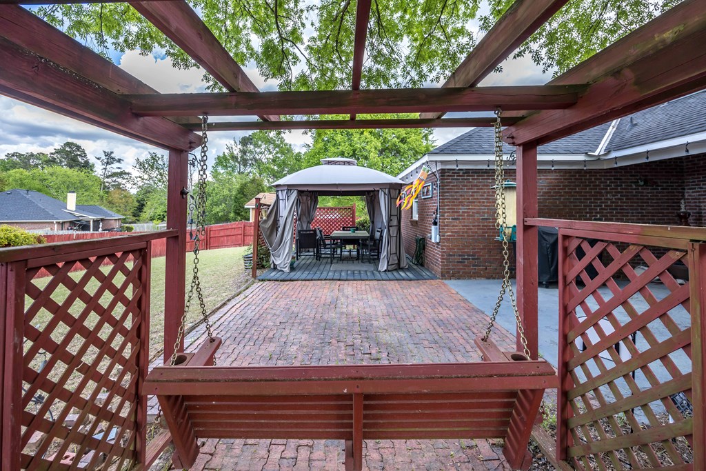 5017 Emerald Isle Court Columbus, GA 31909 - Photo 30 of 37 a view of a backyard with a deck and wooden floor