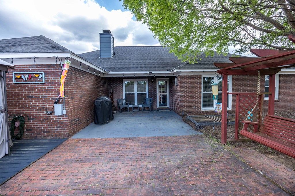 5017 Emerald Isle Court Columbus, GA 31909 - Photo 32 of 37 a view of a house with a patio and a yard