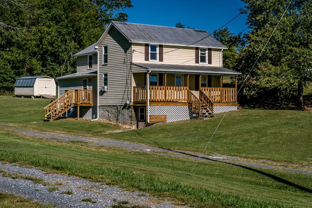 396 Lick Run Road Mount Solon, VA 22843 - Photo 1 of 35 a front view of a house with a garden