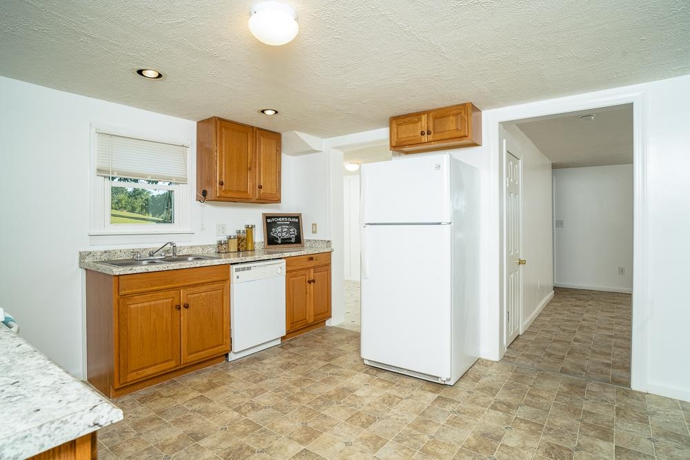 396 Lick Run Road Mount Solon, VA 22843 - Photo 3 of 35 a kitchen with refrigerator cabinets and wooden floor