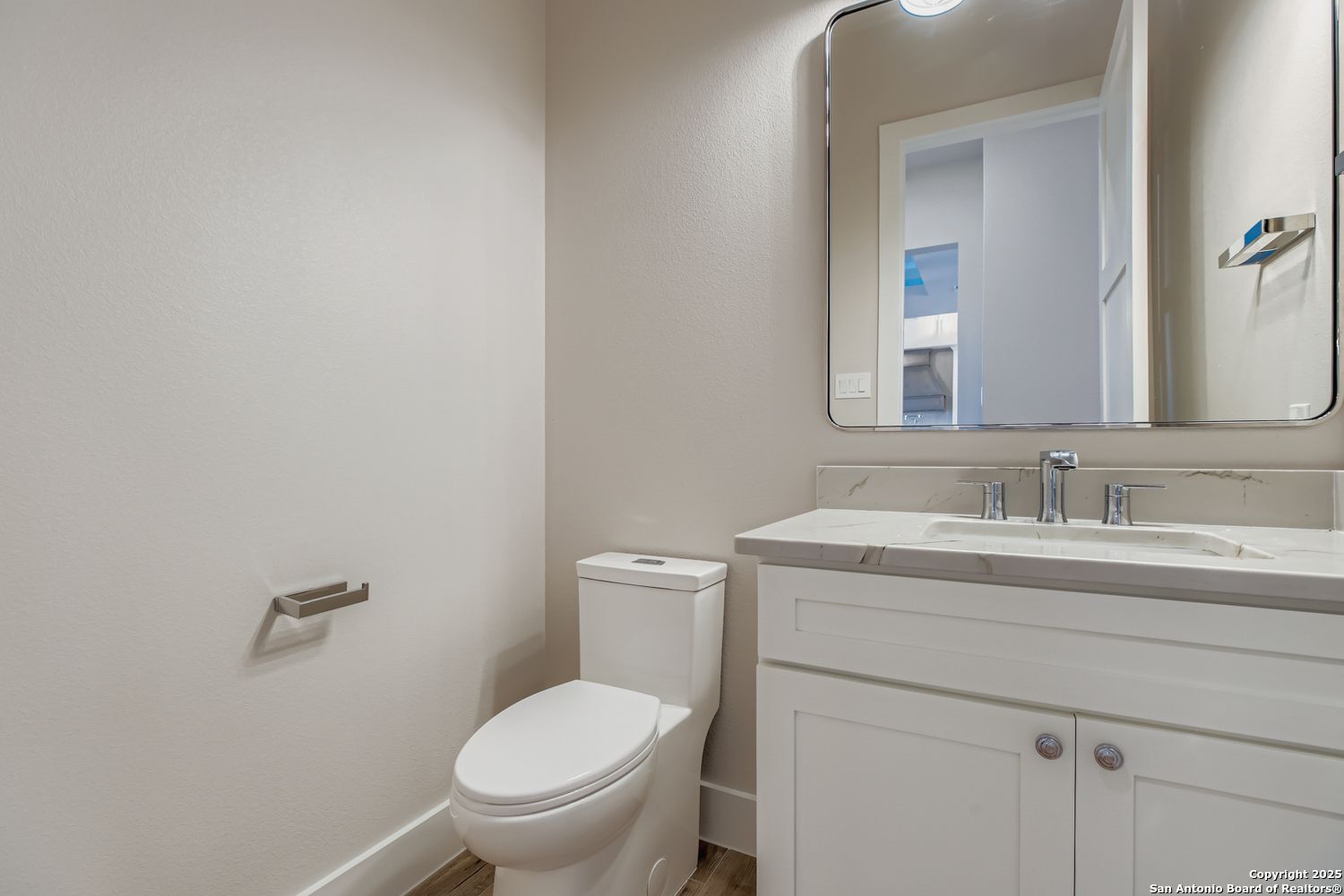23202 Walker Ridge San Antonio, TX 78255 - Photo 17 of 44 a bathroom with a granite countertop toilet sink and mirror