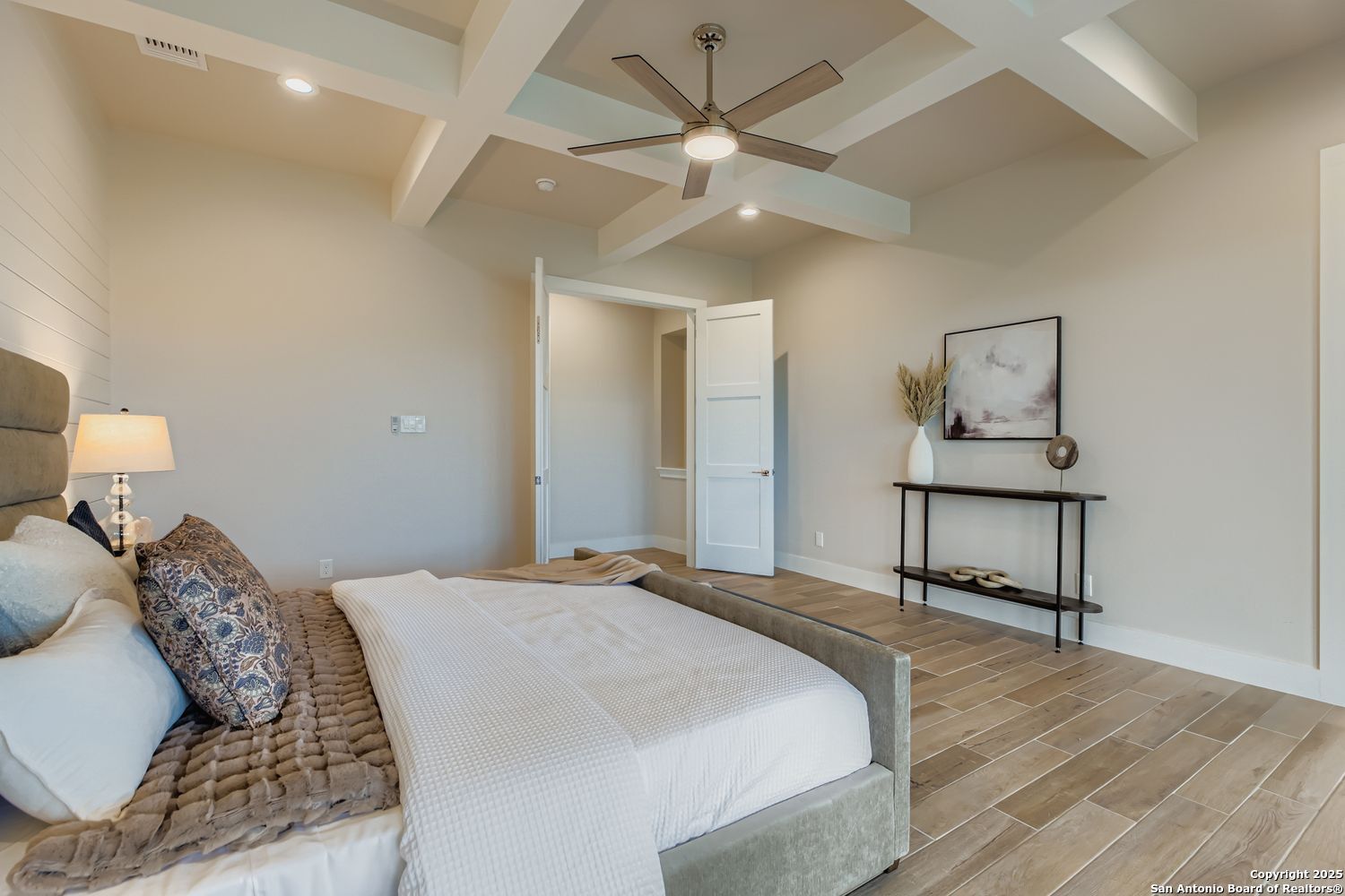 23202 Walker Ridge San Antonio, TX 78255 - Photo 21 of 44 a bedroom with a bed and a chandelier