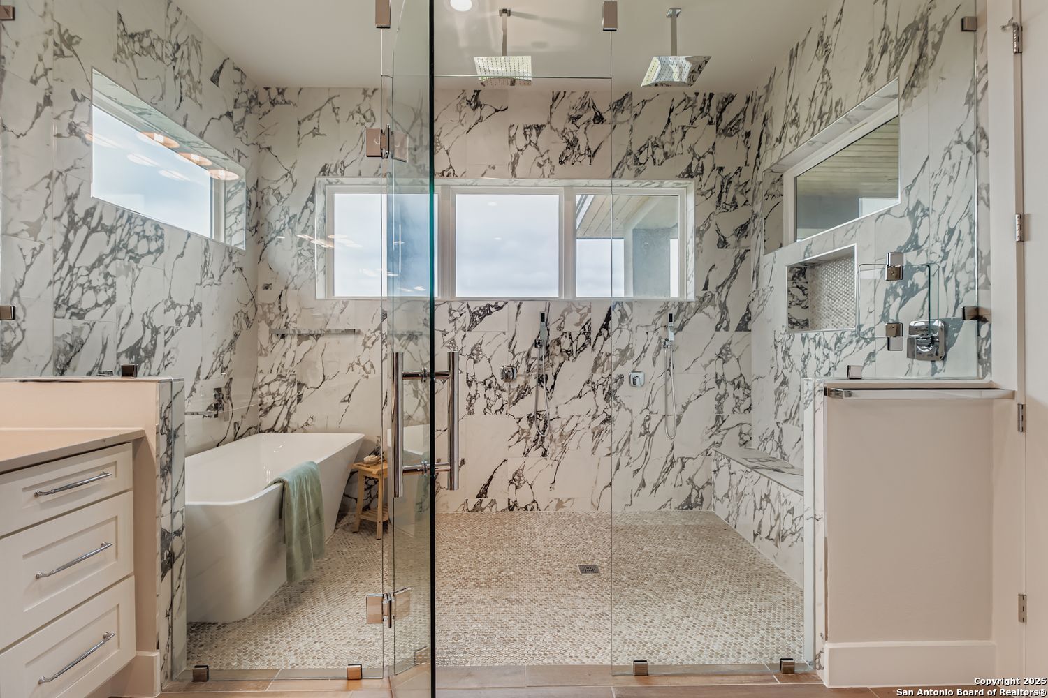 23202 Walker Ridge San Antonio, TX 78255 - Photo 23 of 44 a bathroom with a bathtub and shower