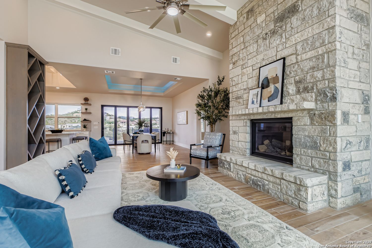 23202 Walker Ridge San Antonio, TX 78255 - Photo 4 of 44 a living room with furniture and a fireplace