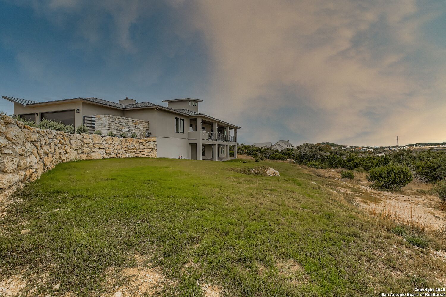 23202 Walker Ridge San Antonio, TX 78255 - Photo 41 of 44 a view of a house with a yard