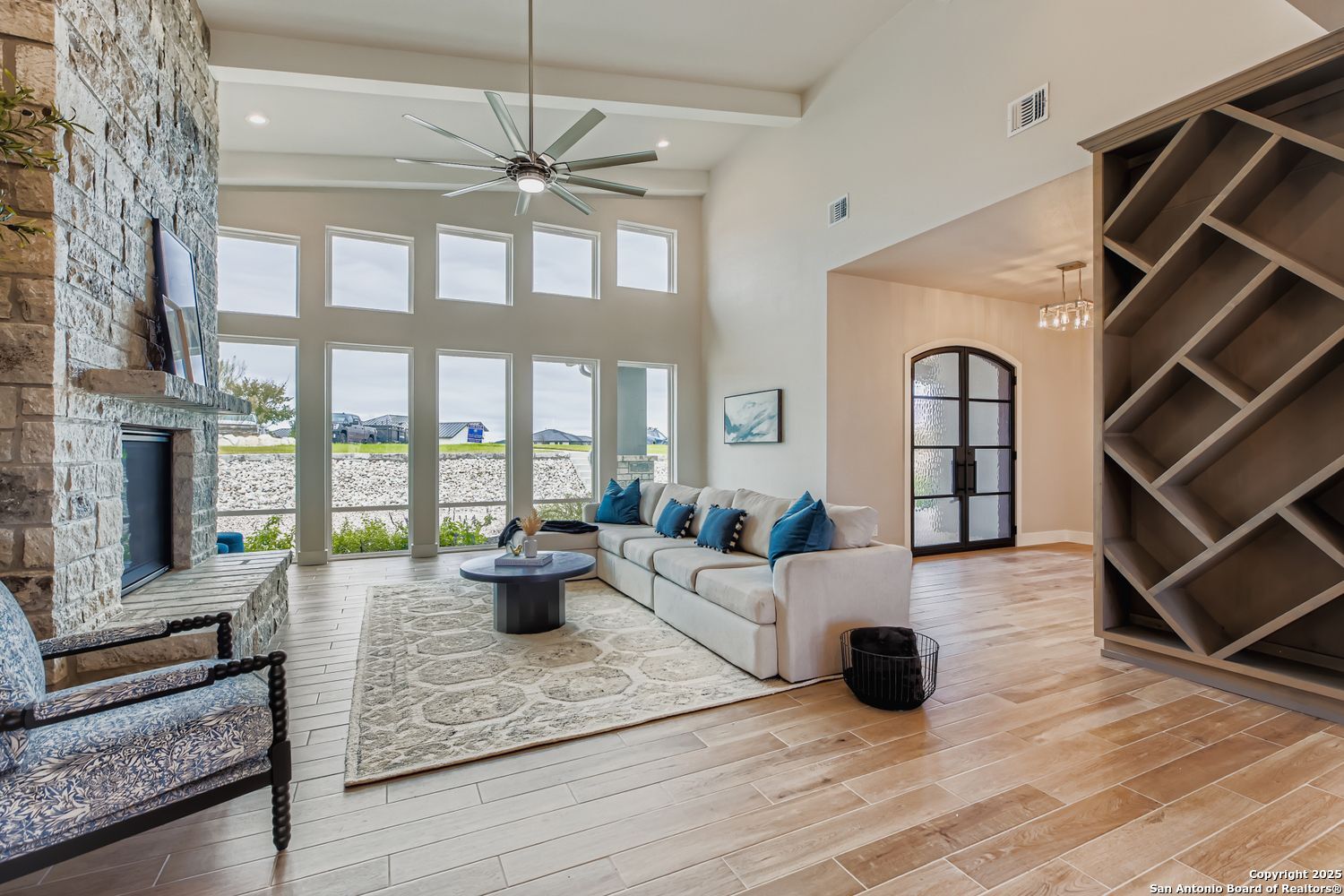23202 Walker Ridge San Antonio, TX 78255 - Photo 6 of 44 a living room with furniture and a fireplace