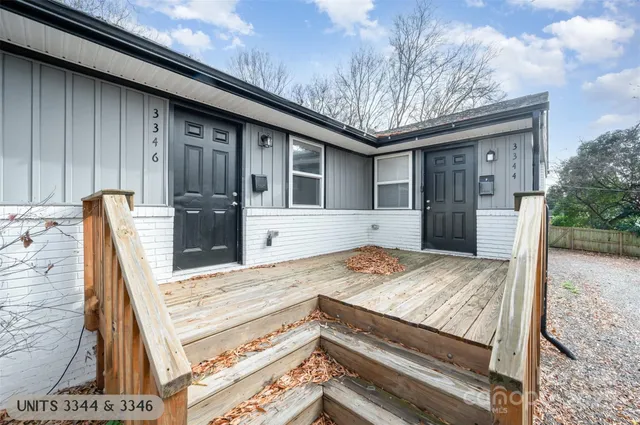 a view of kitchen with cabinets and refrigerator