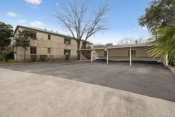 a wooden bench sitting in middle of a yard