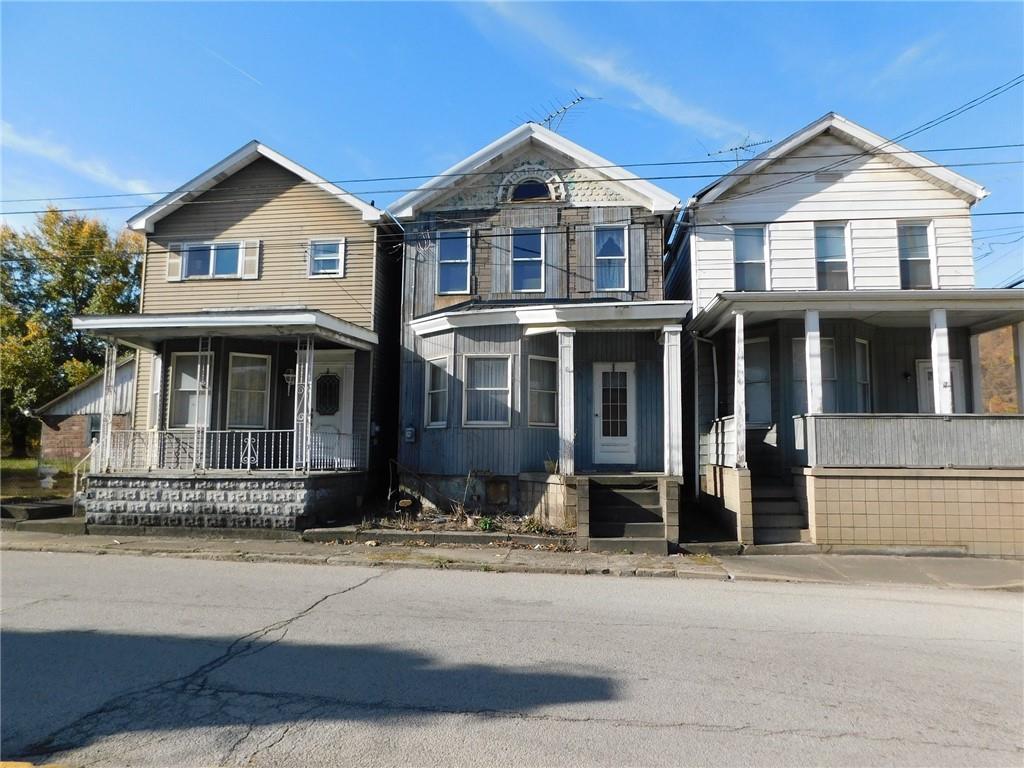 102 2nd Street Fayette City, PA 15438 - Photo 5 of 6 a front view of a house with a yard