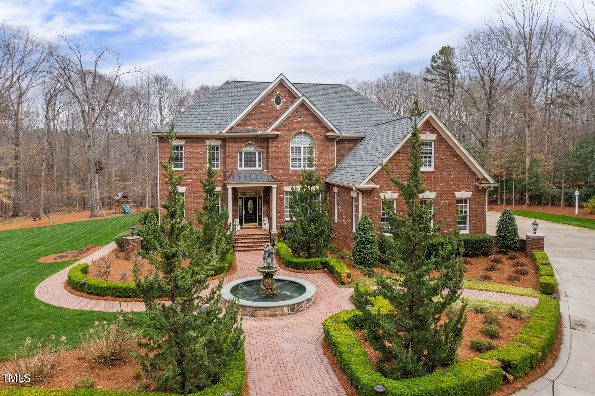 a front view of house with yard and green space