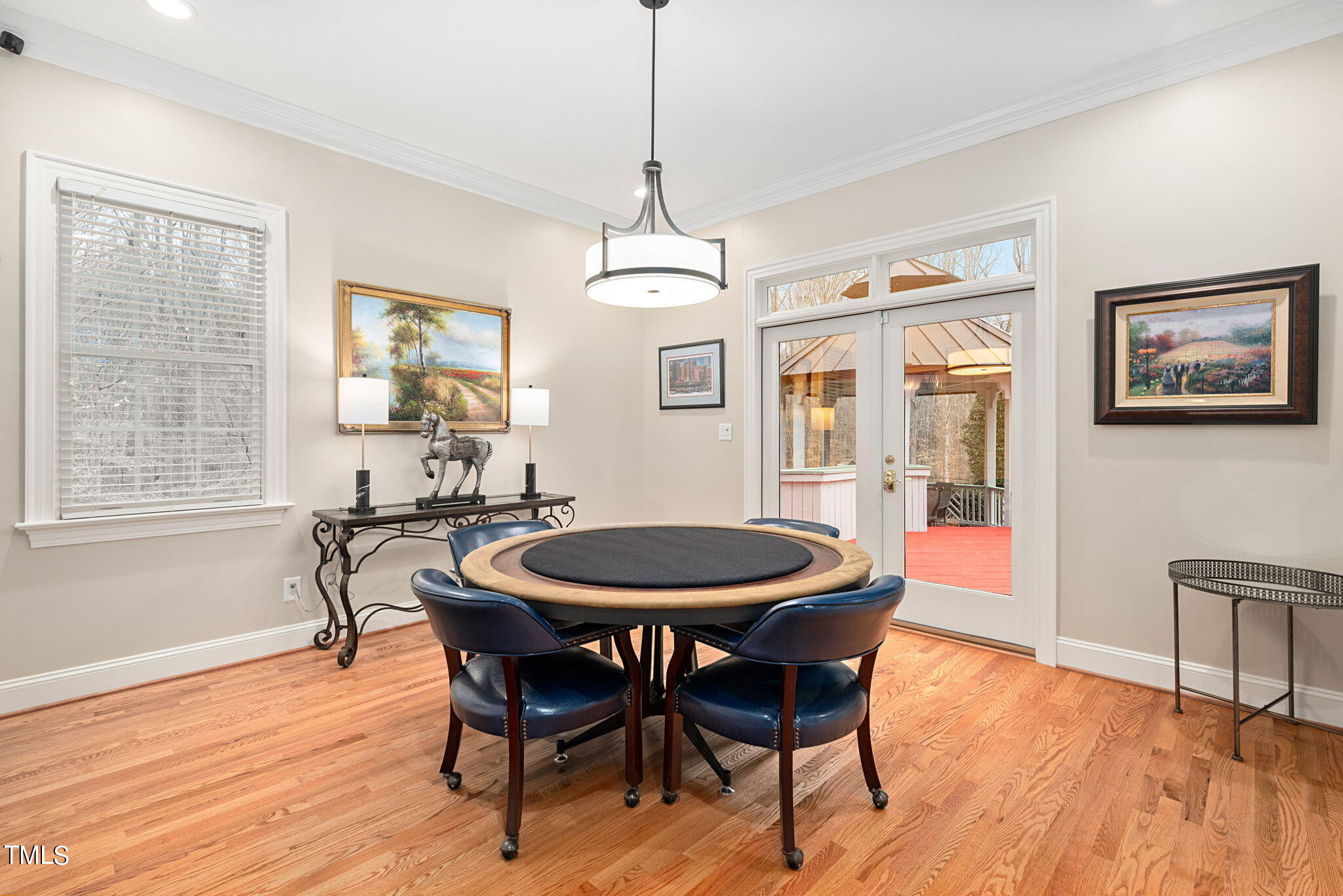 1625 Morning Mountain Road Raleigh, NC 27614 - Photo 14 of 50 a dining room with furniture a chandelier and wooden floor