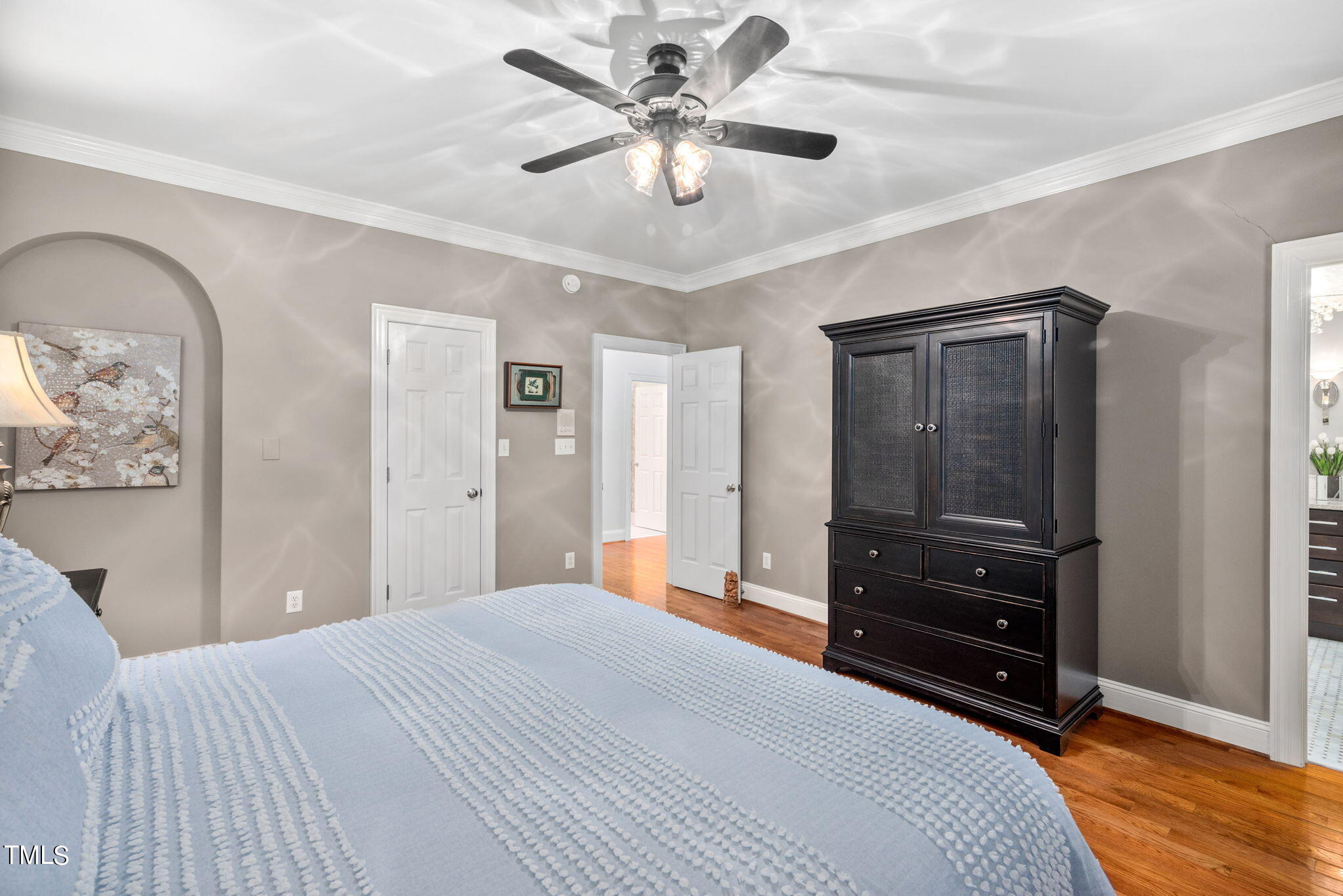 1625 Morning Mountain Road Raleigh, NC 27614 - Photo 21 of 50 a bedroom with a bed and a chandelier