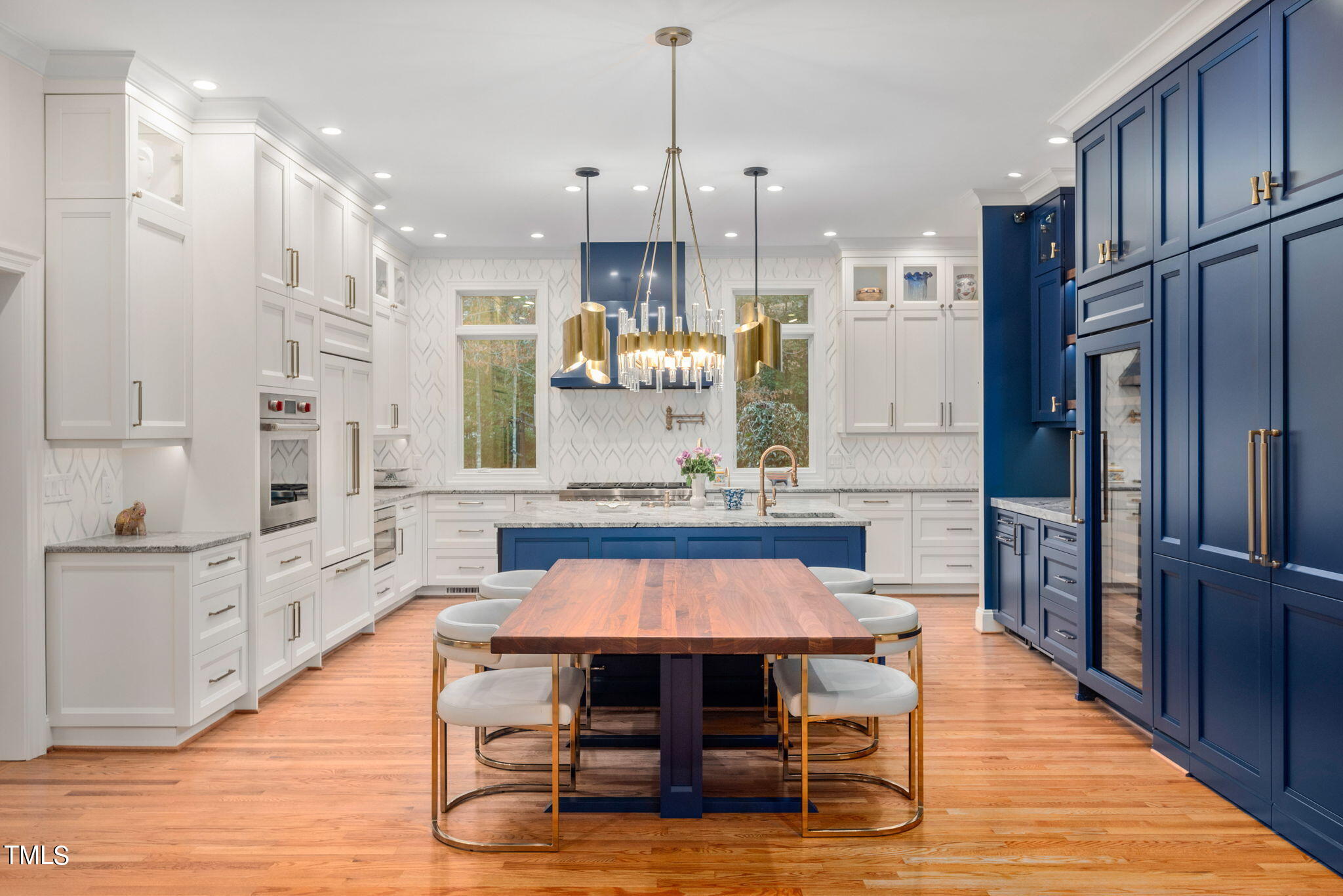 1625 Morning Mountain Road Raleigh, NC 27614 - Photo 3 of 50 a kitchen with stainless steel appliances kitchen island granite countertop a table chairs in it and wooden floors