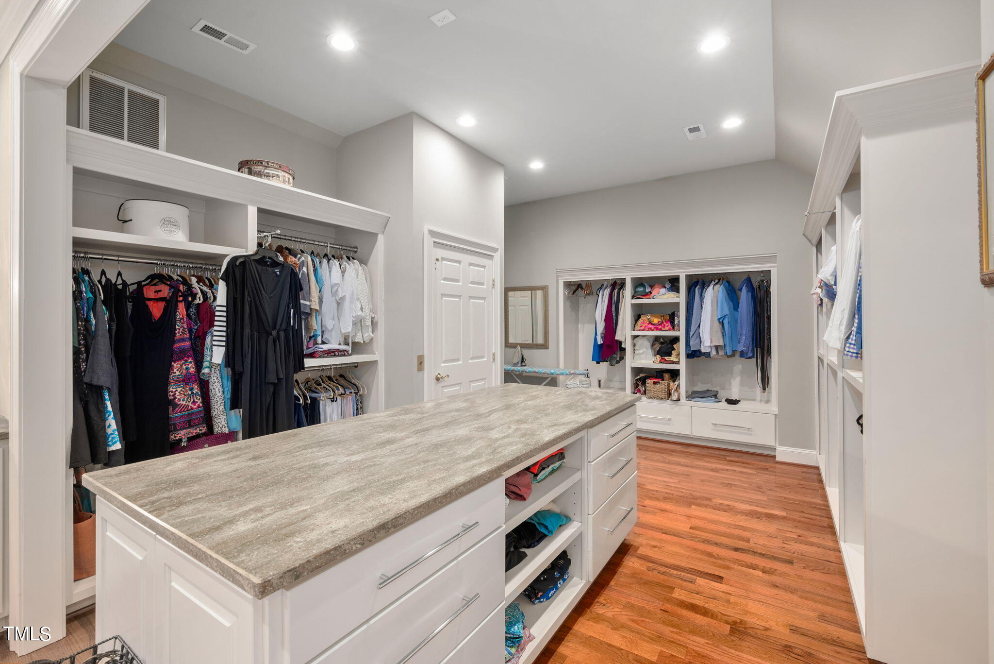 1625 Morning Mountain Road Raleigh, NC 27614 - Photo 32 of 50 a room with kitchen island a table and a refrigerator