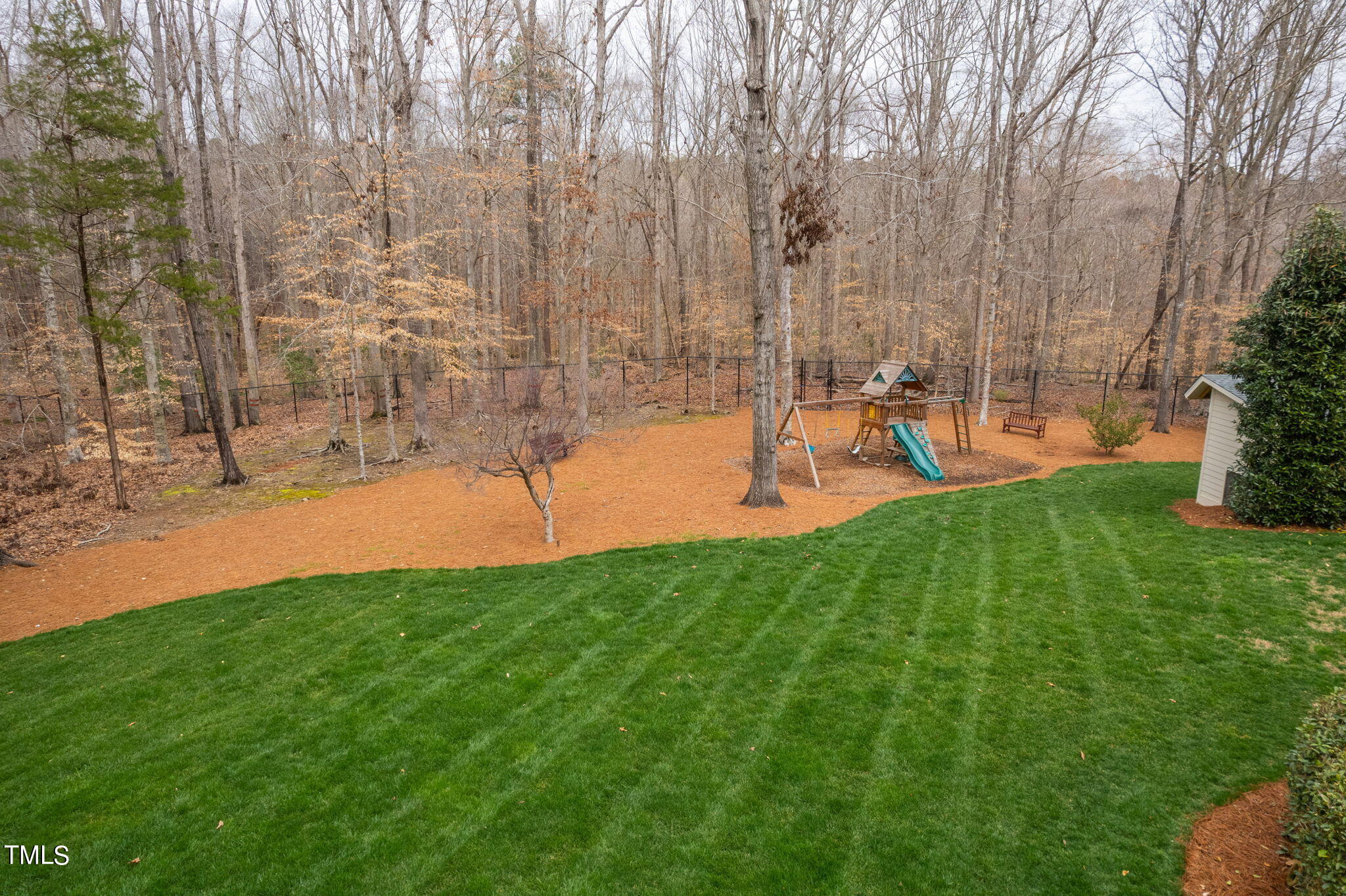 1625 Morning Mountain Road Raleigh, NC 27614 - Photo 39 of 50 a view of a backyard with a garden