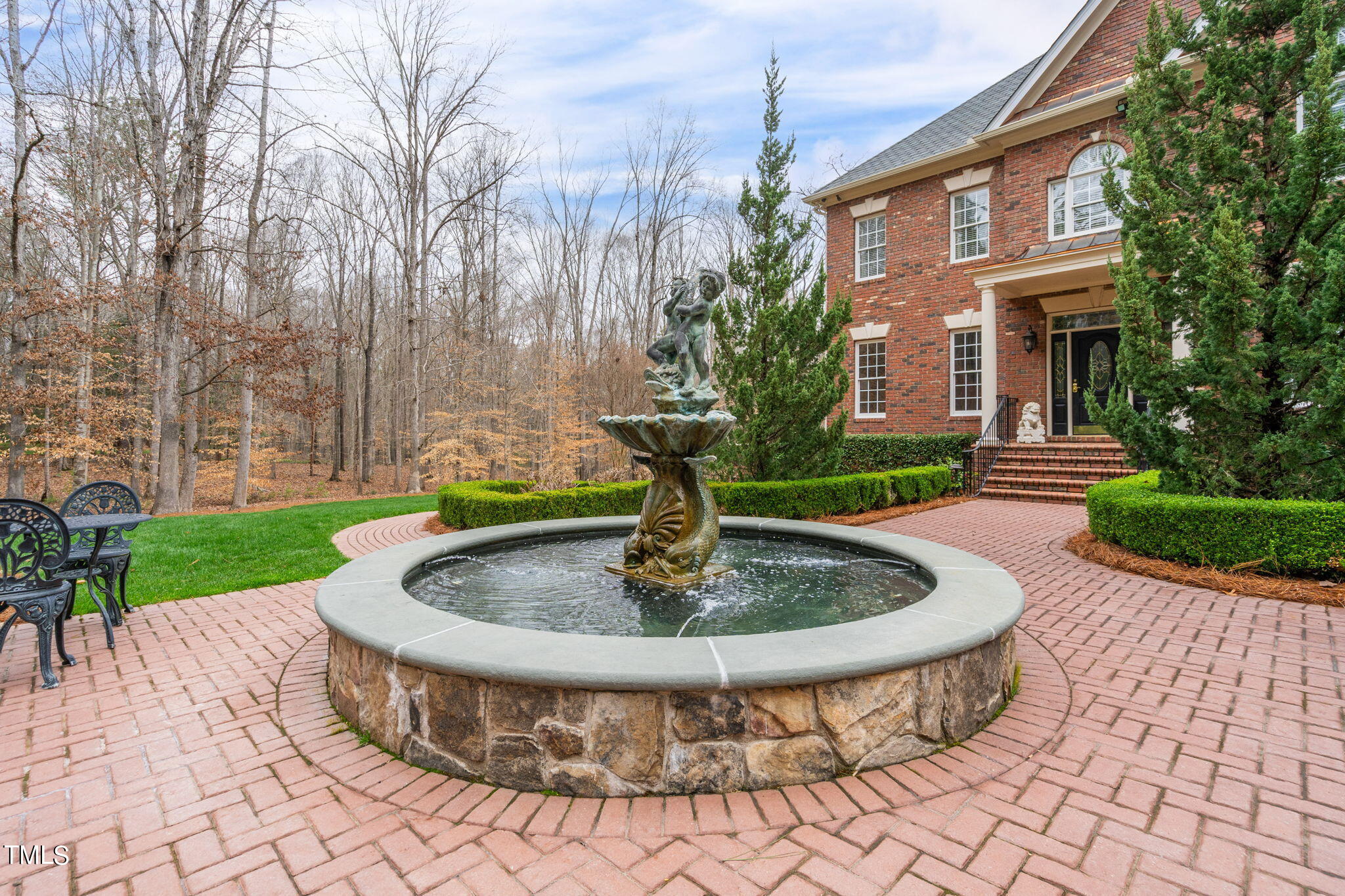 1625 Morning Mountain Road Raleigh, NC 27614 - Photo 43 of 50 a view of a fire pit with a fountain