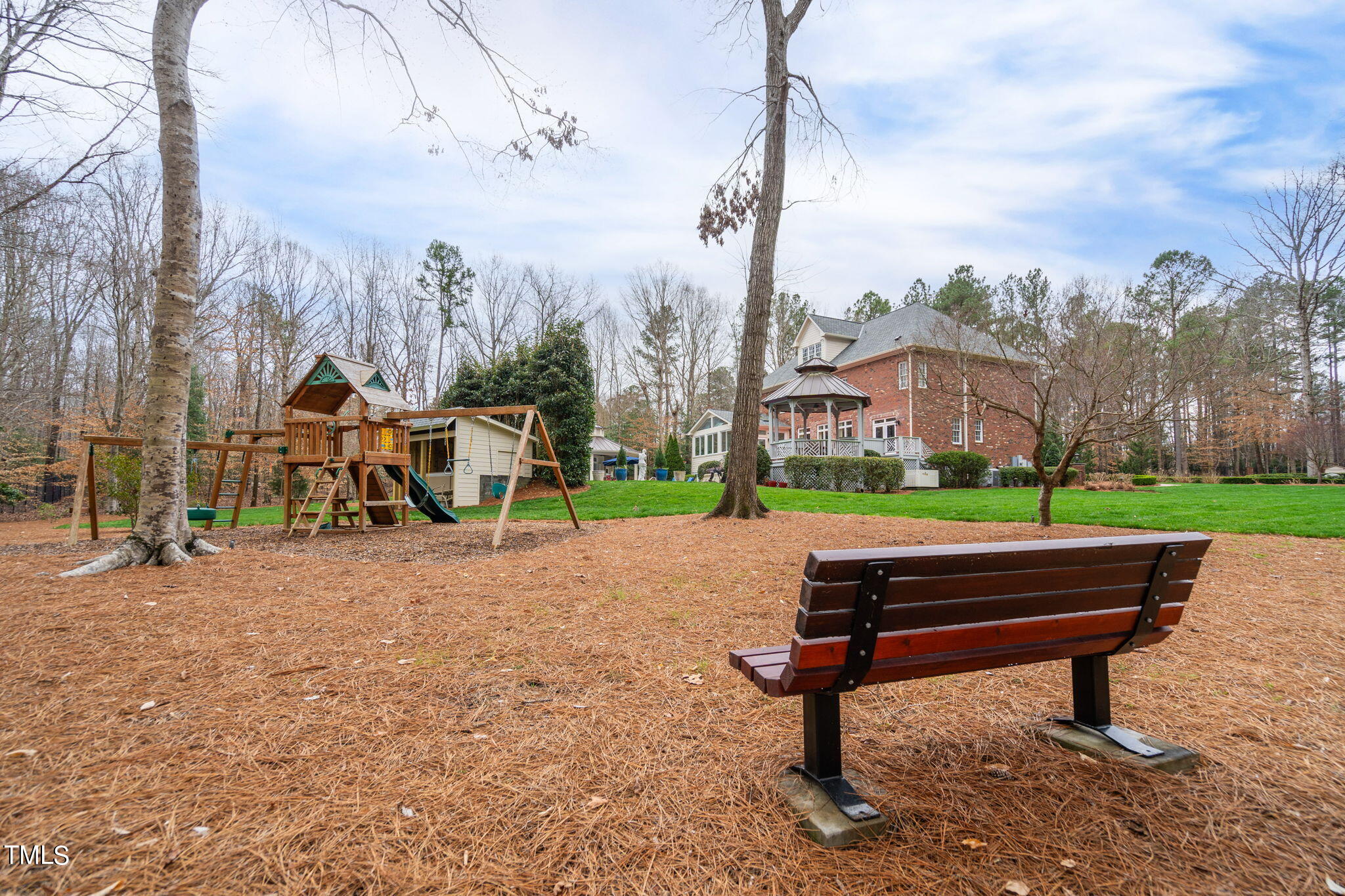 1625 Morning Mountain Road Raleigh, NC 27614 - Photo 49 of 50 a park bench sitting in the middle of a park
