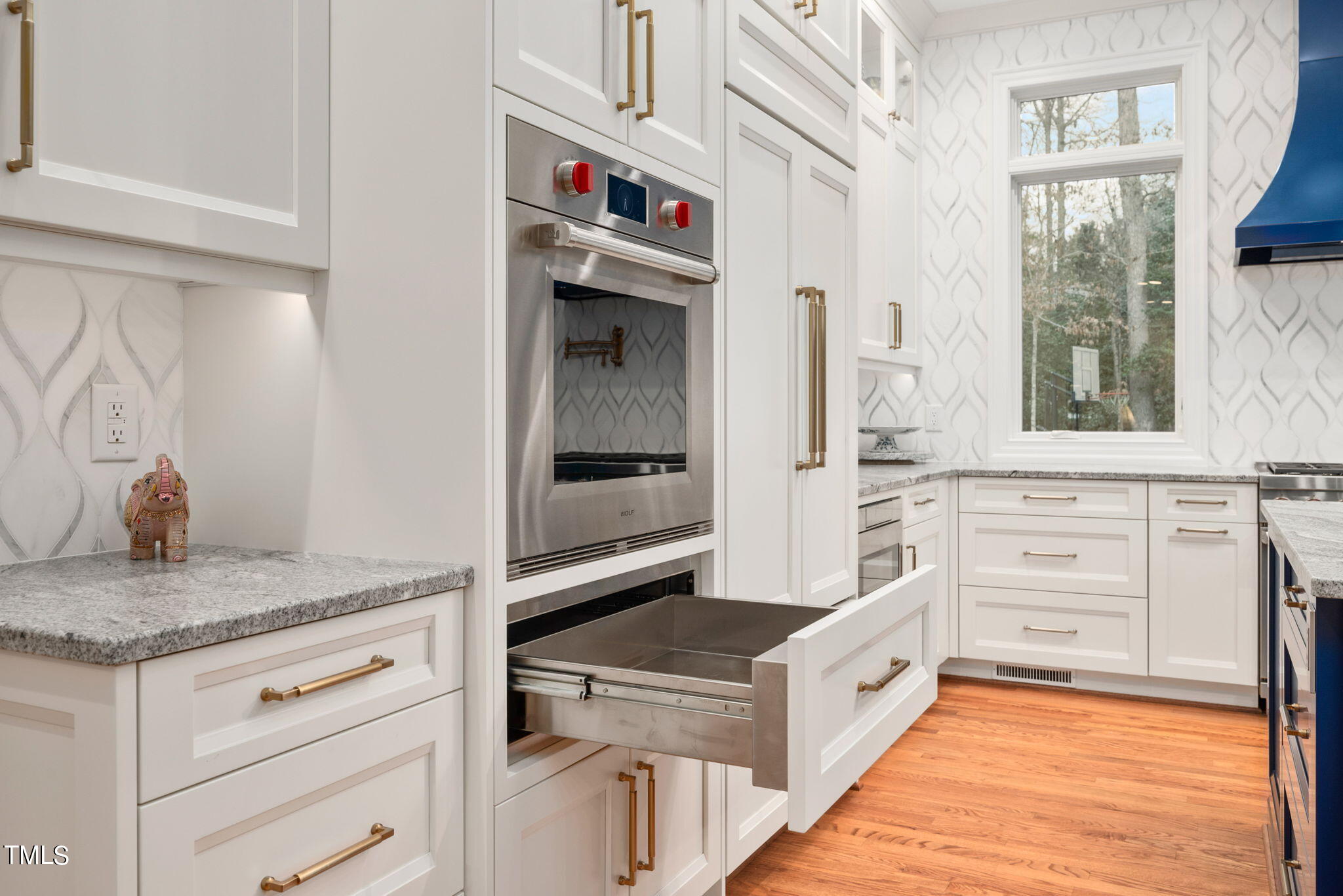 1625 Morning Mountain Road Raleigh, NC 27614 - Photo 6 of 50 a kitchen with white cabinets and a sink
