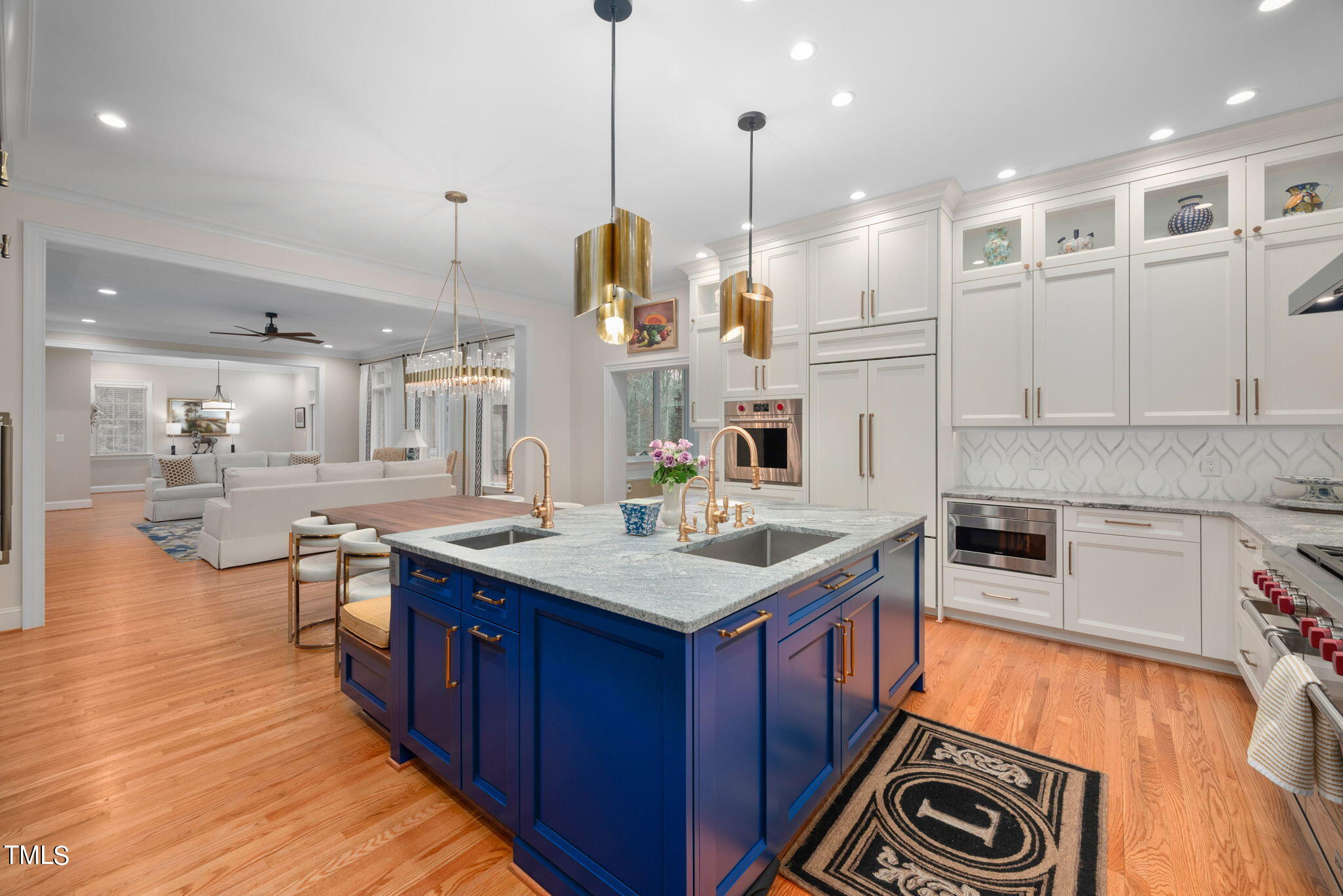1625 Morning Mountain Road Raleigh, NC 27614 - Photo 9 of 50 a kitchen with stainless steel appliances granite countertop a sink a stove and a wooden floors