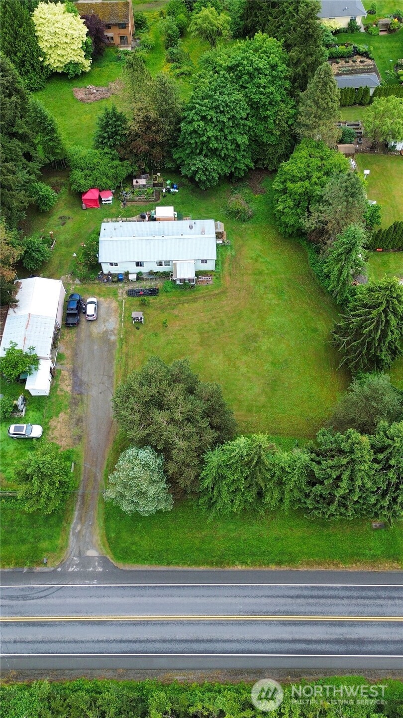 7185 Old Highway 99 North Road Burlington, WA 98233 - Photo 5 of 26 a view of a garden with a fountain
