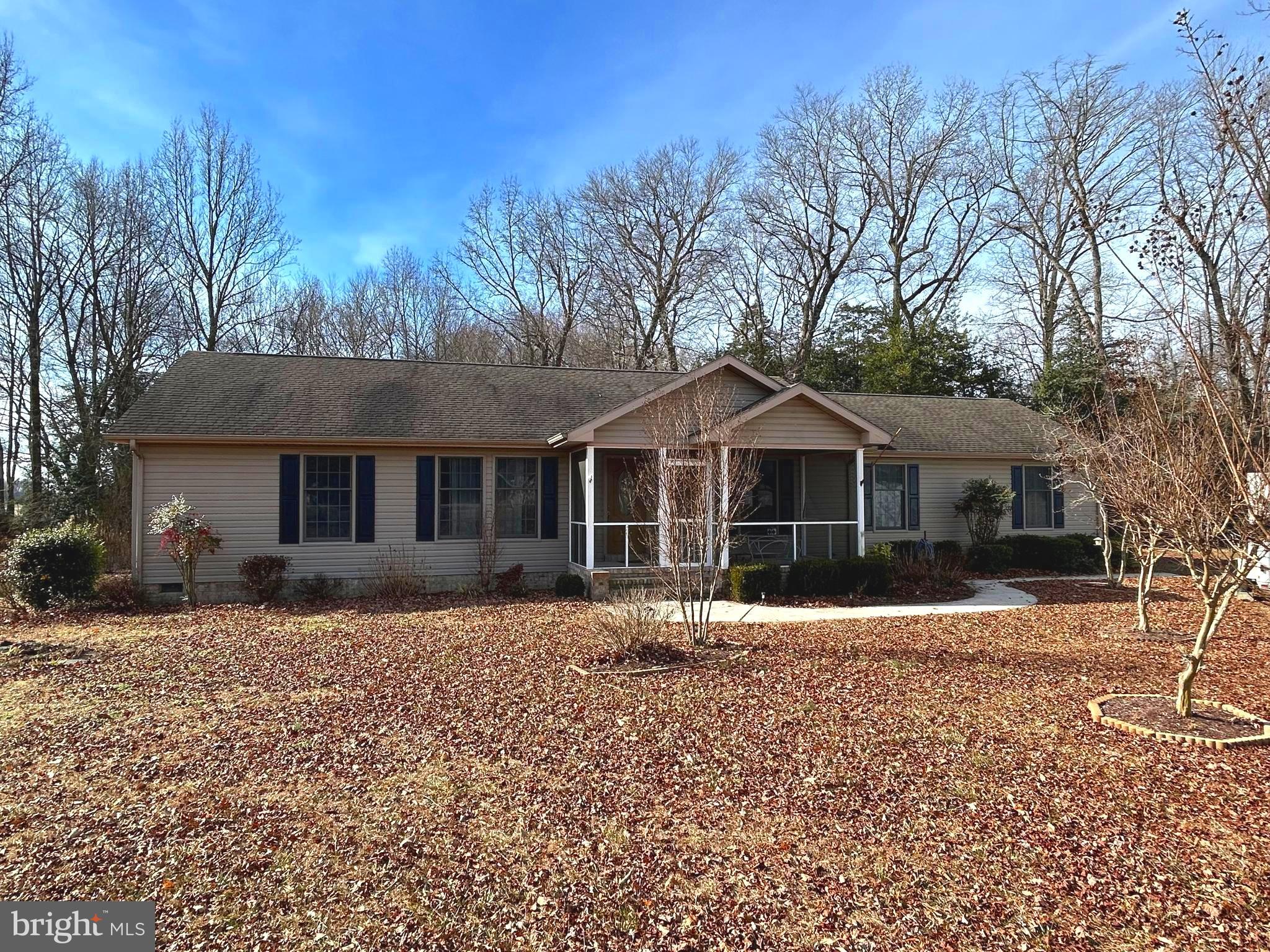 3136 McDowell Road Bridgeville, DE 19933 - Photo 1 of 32 a front view of a house with a yard