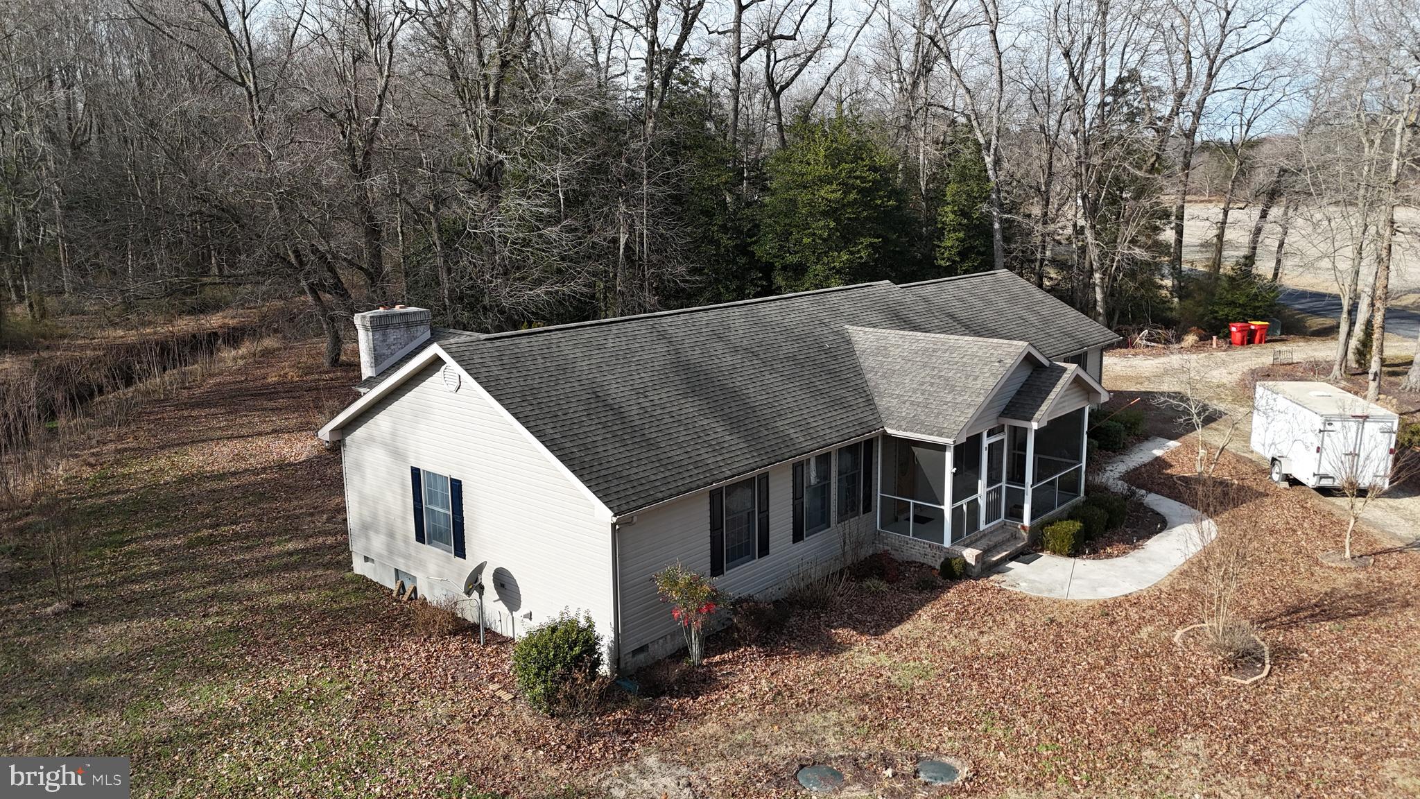 3136 McDowell Road Bridgeville, DE 19933 - Photo 16 of 32 a view of a house with backyard and sitting area