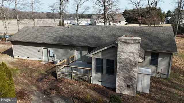 a view of a house with wooden fence