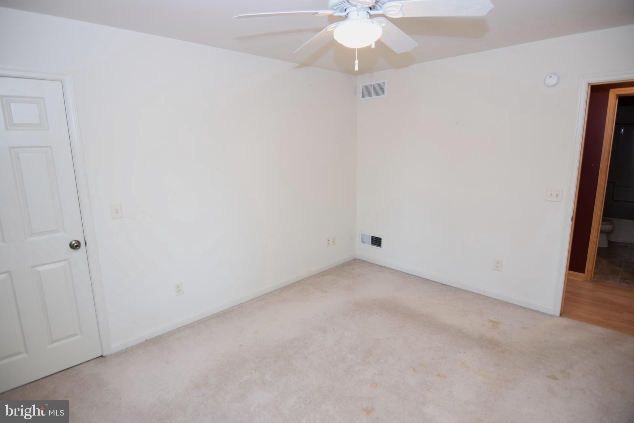 3136 McDowell Road Bridgeville, DE 19933 - Photo 26 of 32 an empty room with a chandelier fan