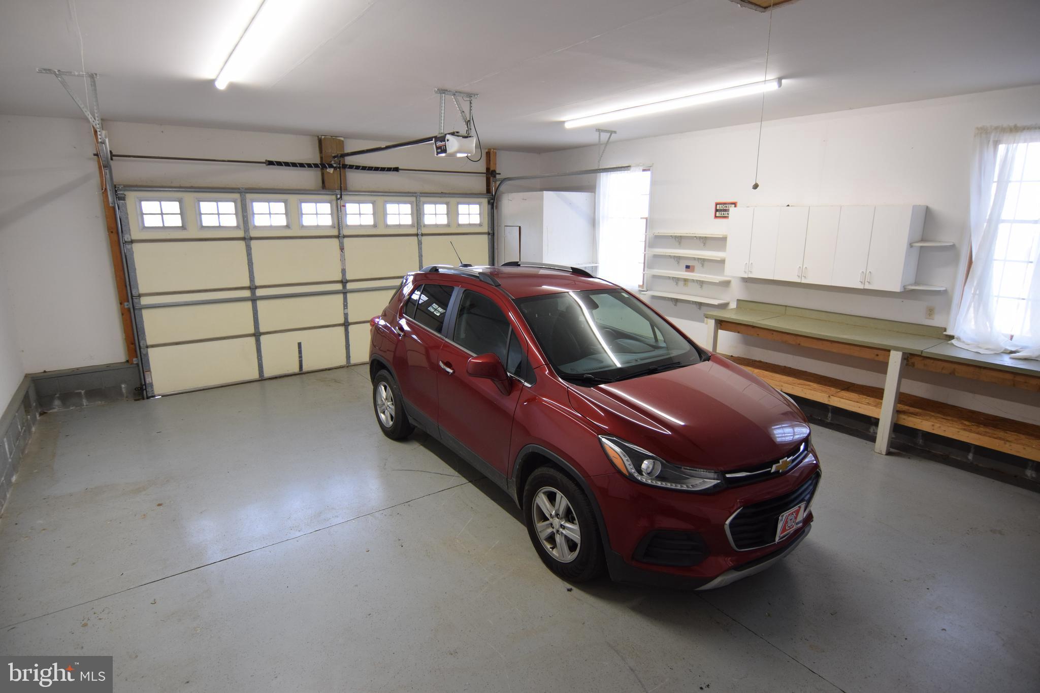 3136 McDowell Road Bridgeville, DE 19933 - Photo 28 of 32 a car is parked in a garage