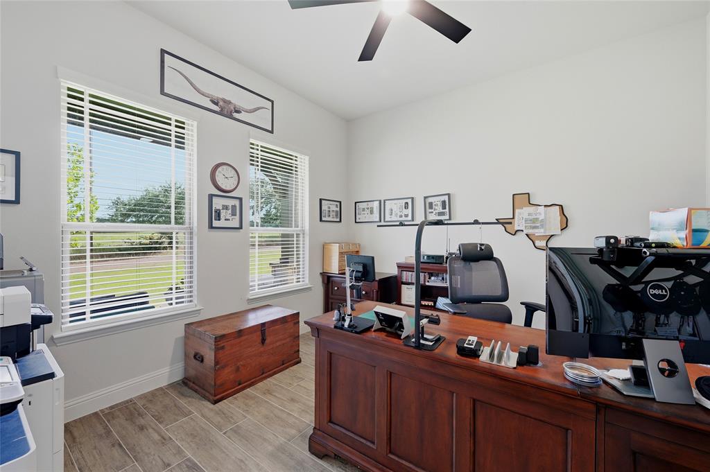 864 Shadow Valley Road Whitesboro, TX 76273 - Photo 27 of 40 Spacious room with wood-finish flooring and a ceiling fan