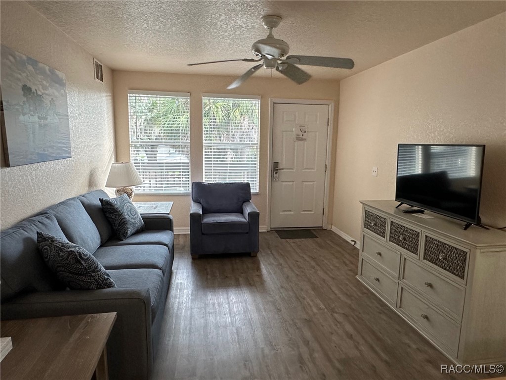 5291 South Cherokee Way Homosassa, FL 34448 - Photo 8 of 27 a living room with furniture and a flat screen tv