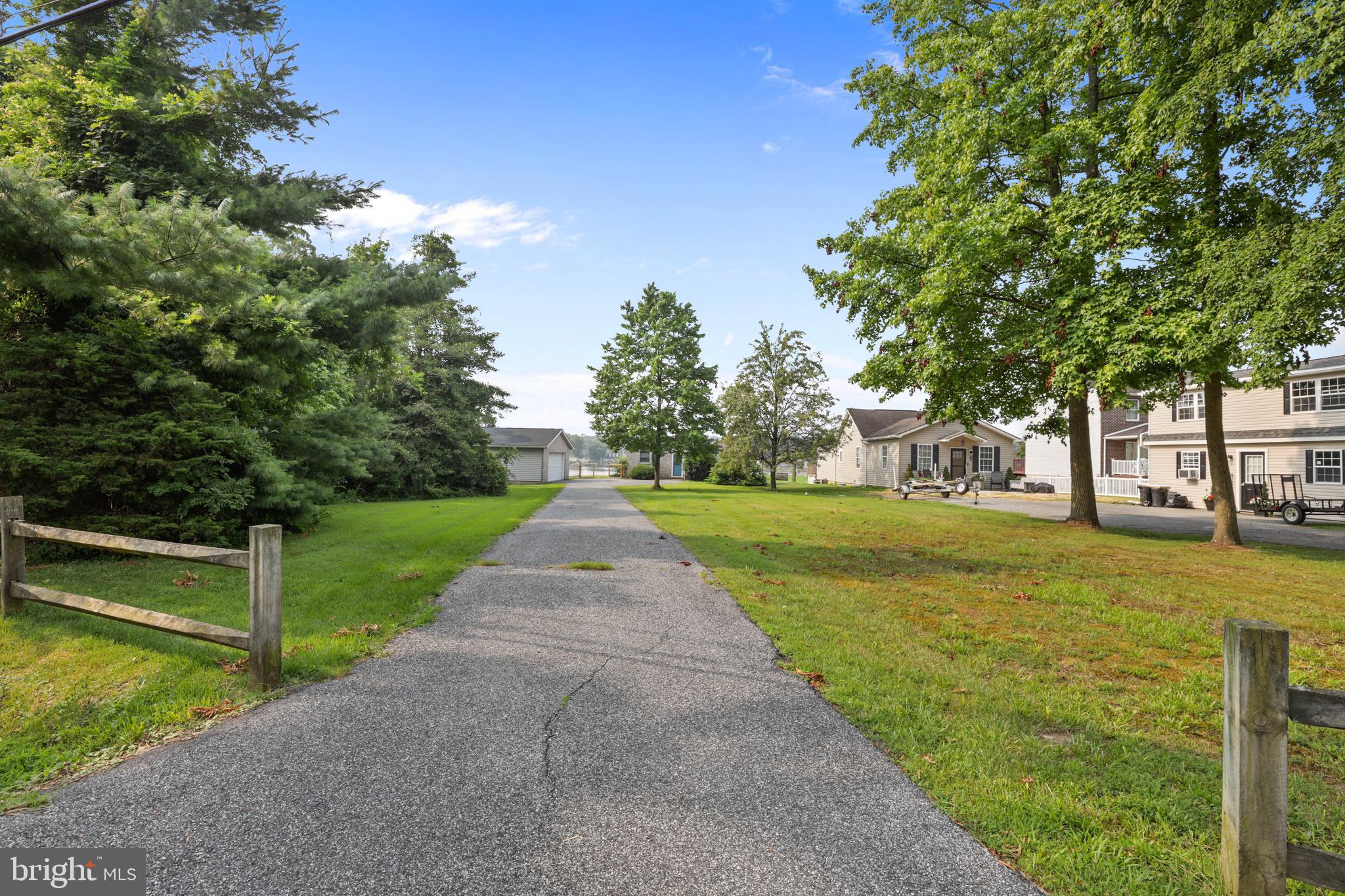 Long driveway on nearly 1 acre