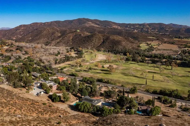 a view of a dining area with furniture wooden floor and a rug