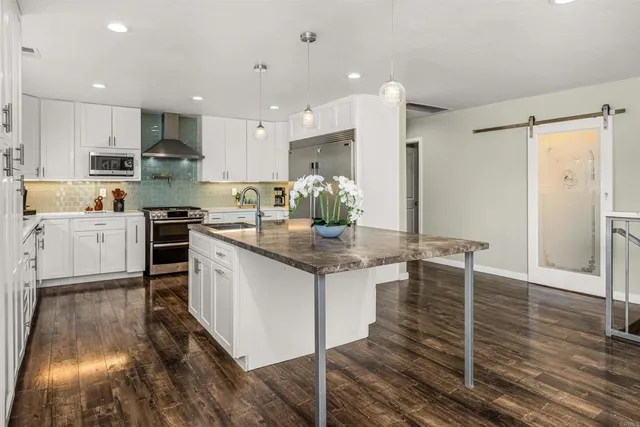 a view of a hallway with washer and dryer