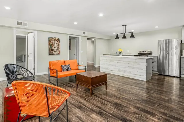 a view of a swimming pool with a patio and a yard