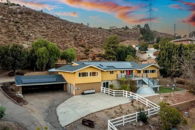 an aerial view of a house with swimming pool