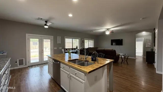 a view of a a dining table chairs and wooden floor