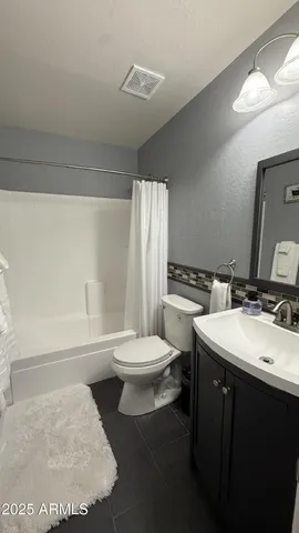 a bathroom with a sink a toilet and a bathtub