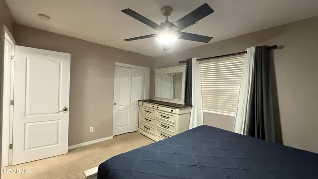 a bathroom with a tub shower vanity and a sink