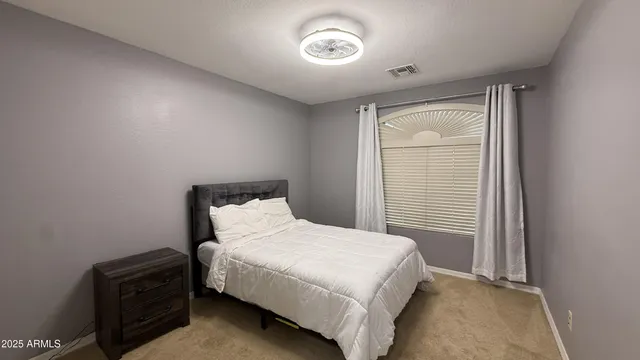 a view of a backyard patio and entertaining space