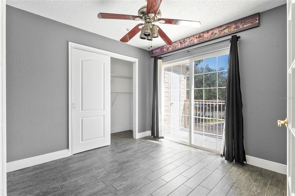660 Youngstown Parkway, Unit 282 Altamonte Springs, FL 32714 - Photo 11 of 22 an empty room with wooden floor closet and windows