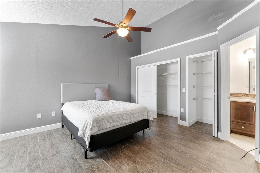 660 Youngstown Parkway, Unit 282 Altamonte Springs, FL 32714 - Photo 12 of 22 a bedroom with a bed and a ceiling fan